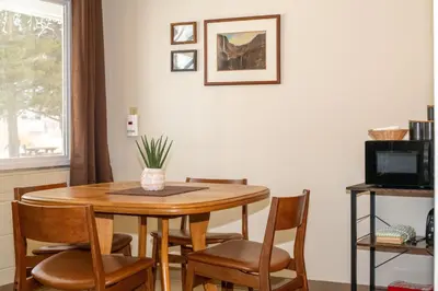 a dining room with a table and chairs at Gull Lake Lodge in June Lake