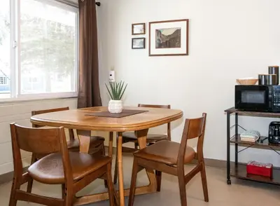 a dining room table and chairs in a room at Gull Lake Lodge in June Lake