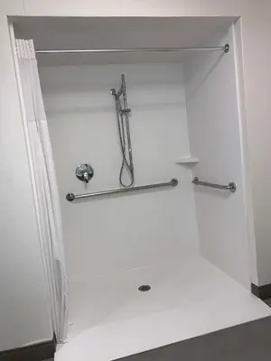 a white bathroom with a shower with two bars at Hampton Inn & Suites Carson City in Carson City