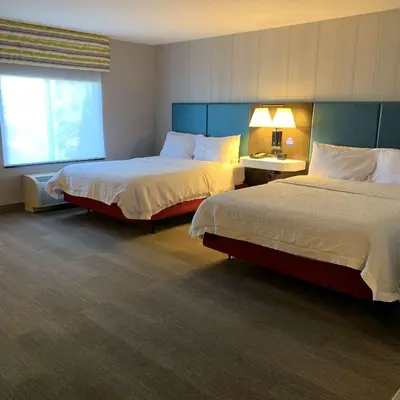 a hotel room with two beds and a window at Hampton Inn & Suites Carson City in Carson City