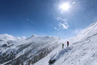 two people standing on top of a snow covered mountain at 3302 Sun Meadows in Kirkwood