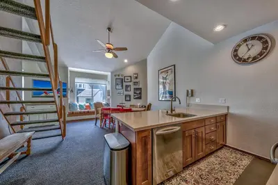 a kitchen with a sink and a clock on the wall at 3302 Sun Meadows in Kirkwood