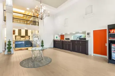 a large kitchen with a table in a room at Best Western Plus Villa Del Lago Inn Patterson in Patterson