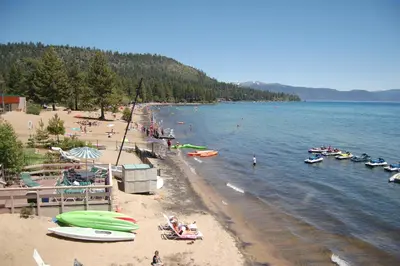 a beach with a bunch of boats on the water at Crown Motel in Kings Beach