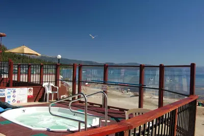 a hot tub on a balcony with a view of the ocean at Crown Motel in Kings Beach