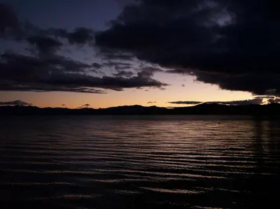 a sunset over a large body of water at Crown Motel in Kings Beach