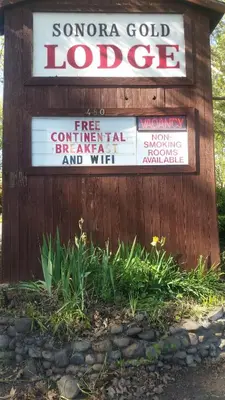 a sign for a localldicated sign for a company at The Gold Lodge in Sonora