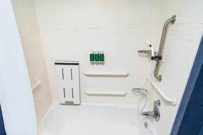 a white bathroom with a shower and a sink at Residence Inn by Marriott Rocklin Roseville in Roseville