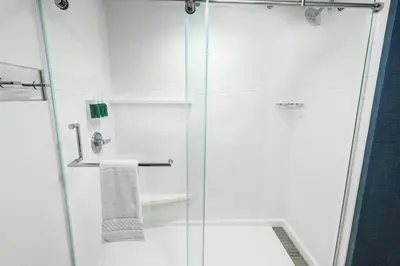 a bathroom with a shower with a glass door at Residence Inn by Marriott Rocklin Roseville in Roseville