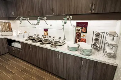 a kitchen with plates and pans on a counter at Residence Inn by Marriott Rocklin Roseville in Roseville