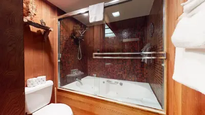 a bathroom with a bath tub and a toilet at Tennis Village 14 Townhouse in Mammoth Lakes