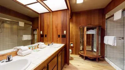 a bathroom with two sinks and a large mirror at Tennis Village 14 Townhouse in Mammoth Lakes