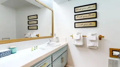 a bathroom with a sink and a mirror at Snowcreek 887 Condo in Mammoth Lakes