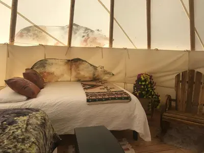 a bedroom with a bed in a tent at Olancha RV Park and Motel in Olancha