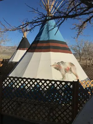 a tent with a horse painted on the side of it at Olancha RV Park and Motel in Olancha