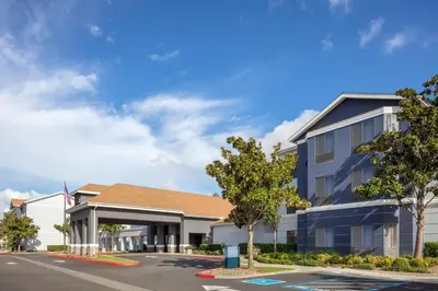 a rendering of the front of a building at Homewood Suites by Hilton Fresno in Fresno