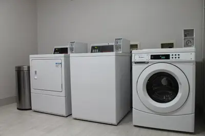 a washing machine and a dryer in a room at Holiday Inn Express & Suites - Tulare by IHG in Tulare