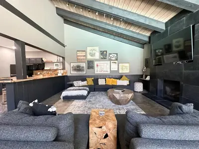 a living room with two couches and a table at Chamonix Condo 94 Condo in Mammoth Lakes