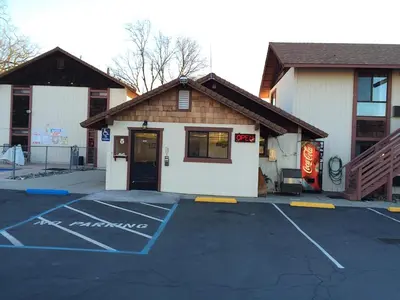 a parking lot in front of a building at Jamestown Railtown Motel in Jamestown