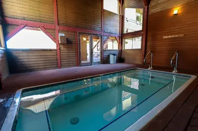 a large swimming pool in a house at Bridges #209 Condo in Mammoth Lakes