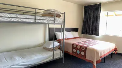 a bedroom with two bunk beds and a bed at Hotel Elevation in South Lake Tahoe