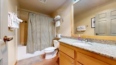 a bathroom with a sink and a toilet and a shower at Sunstone #126 Condo in Mammoth Lakes