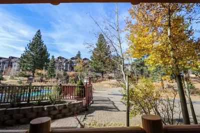 a view of a park with a fence and trees at Sunstone #126 Condo in Mammoth Lakes