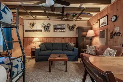 a living room with a couch and a table at Mother Nature's Inn in Tahoe City