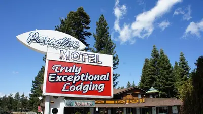 a motel sign in front of a building at Paradice Motel in South Lake Tahoe
