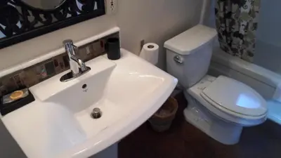 a bathroom with a white sink and a toilet at Paradice Motel in South Lake Tahoe