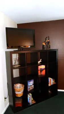 a entertainment center with a flat screen tv on top at Paradice Motel in South Lake Tahoe