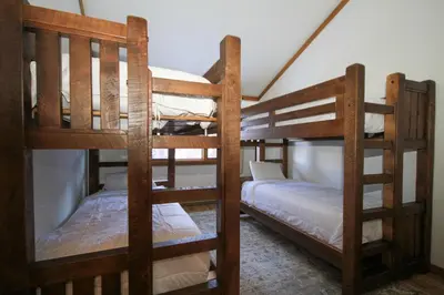 two bunk beds are in a room with at Mountainback 116 LoftCorner in Mammoth Lakes