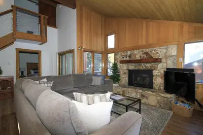 a living room with a couch and a fireplace at Mountainback 116 LoftCorner in Mammoth Lakes