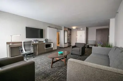 a living room with two couches and a table at Best Western Plus Sparks-Reno Hotel in Reno