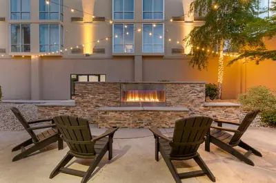 two chairs and a fireplace in front of a building at Best Western Plus Sparks-Reno Hotel in Reno
