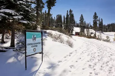 a sign in the snow next to a ski slope at Silver Star Retreat in Ponderosa Fairway Estates