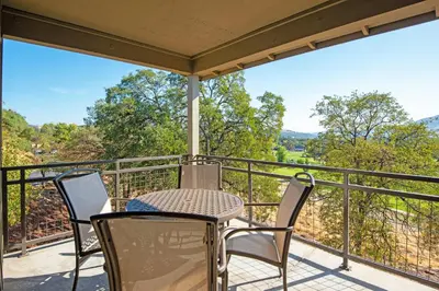 a patio with chairs and a table on a balcony at WorldMark Angels Camp in Angels Camp