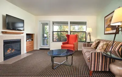 a living room with a couch and a fireplace at WorldMark Angels Camp in Angels Camp