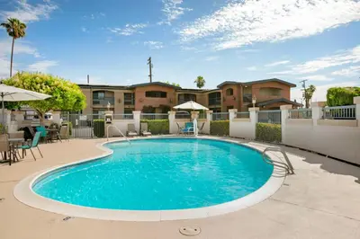 a swimming pool in the middle of a courtyard at Best Western Inn in Merced