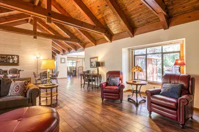 a living room with leather furniture and a wooden ceiling at Skyland Retreat - Max nighttime occupancy of 8 in Zephyr Cove