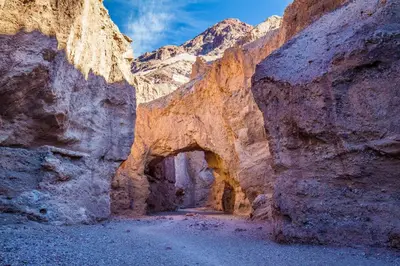 an archway in a canyon in the desert at The Inn at Death Valley in Death Valley