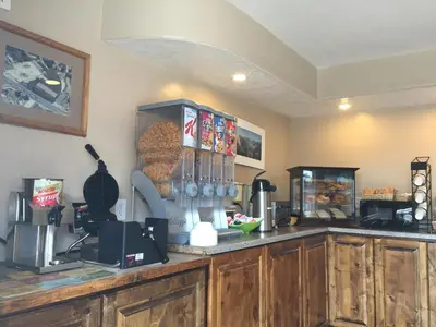 a kitchen with wooden cabinets and a counter top at Oakhurst Lodge in Oakhurst