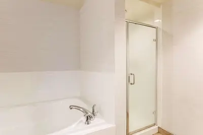 a bathroom with a bath tub and a shower at Hilton Garden Inn Reno in Reno