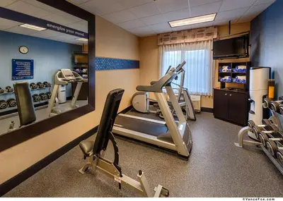 a gym with treadmills and ellipticals in a room at Hampton Inn & Suites Reno in Reno