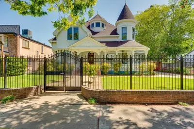 a black fence in front of a house at Lodi Hill House in Lodi