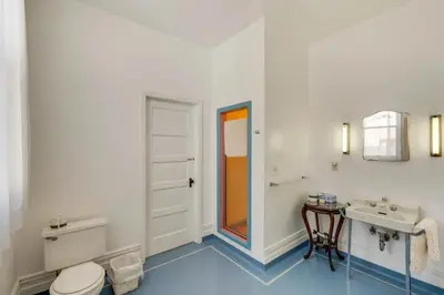 a bathroom with a toilet and a sink at Lodi Hill House in Lodi