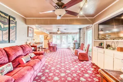 a living room with a couch and a table at A Bed of Roses in Yosemite Forks