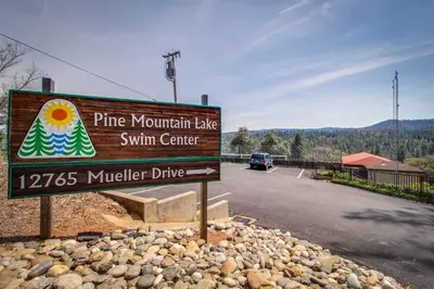 a sign for a pine mountain lake swim center on a road at Cozy Chalet (15-013) in Groveland