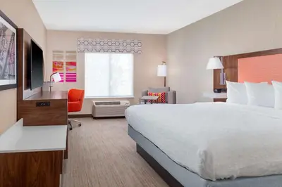 a hotel room with a large bed and a window at Hampton Inn & Suites Sacramento-Auburn Boulevard in Sacramento