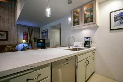 a kitchen with a sink and a counter top at Sunshine Village 104 Condo in Mammoth Lakes